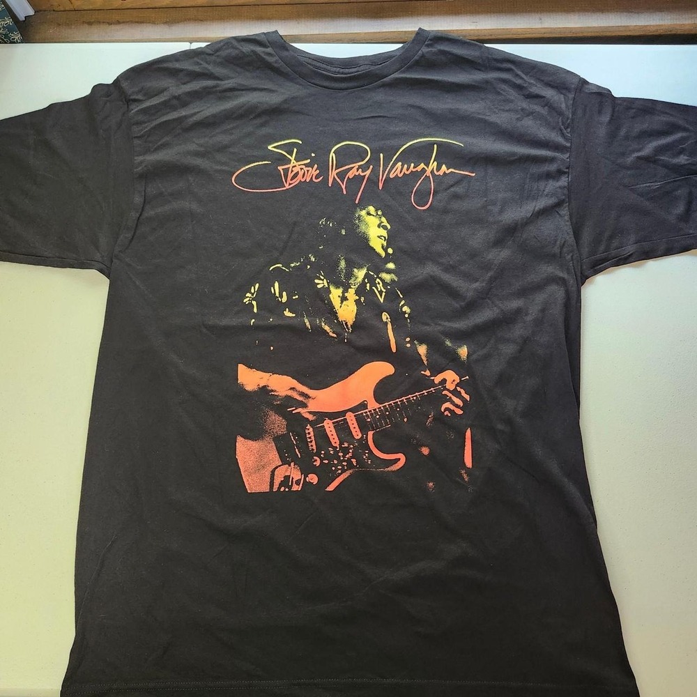 New without tags Stevie Ray Vaughan black cotton t-shirt with orange guitar